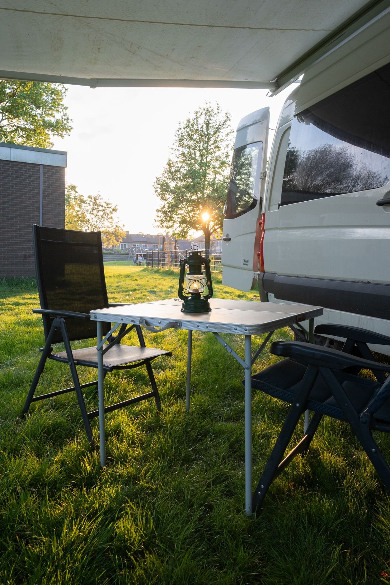 Horizon campervan electric awning extended with outdoor table and chairs